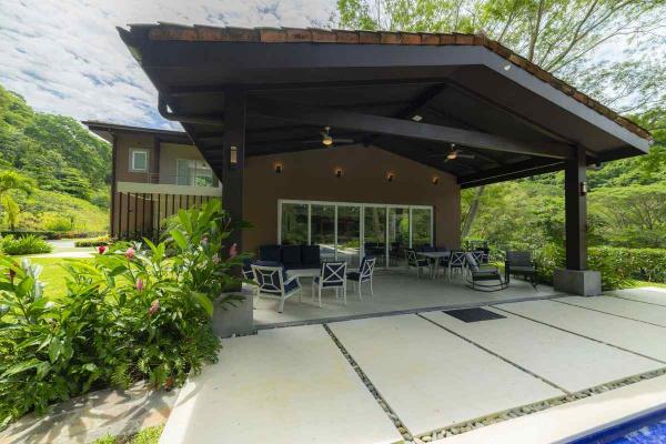 View of the backyard surrounded by tropical plants at Casa Forest in Los Suenos Costa Rica